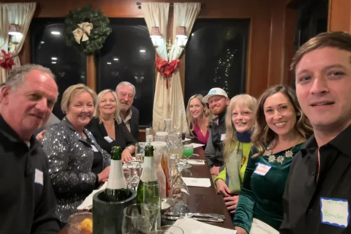 a group of people holding wine glasses